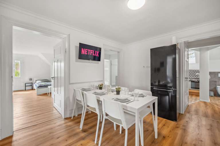 Attic Apartment — dining area with TV
